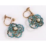 Pair of enamel earrings, the pearl set centres surrounded by pierced turquoise enamel scroll