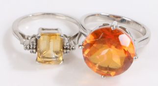 Two silver rings set with orange and yellow paste, ring size N, 8.7g (2)