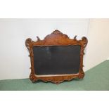 Victorian style walnut veneered wall mirror, with shell, acanthus leaf and scroll decorated frame,