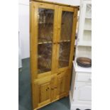 Pine standing corner cupboard, with two lead glazed doors above two panelled cupboard doors, 82cm