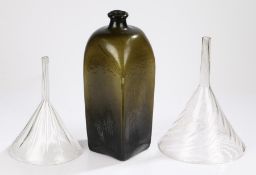 Two Victorian glass funnels with swirled bodies, 29.5cm and 24cm high, large green glass bottle with