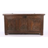 17th Century oak and elm coffer, the hinged rectangular top above an carved frieze and three