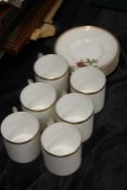 Set of six Royal Worcester porcelain coffee cups and saucers, each decorated with different