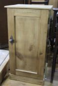 Pine pot cupboard, with panelled door, on a plinth base, 36.5cm wide