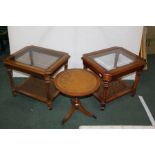 Two walnut occasional table with bevelled glass inset tops, raised on tapering legs and united by