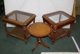 Two walnut occasional table with bevelled glass inset tops, raised on tapering legs and united by