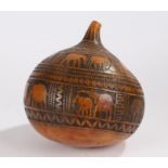 African gourd carved with wild animals and bands of triangular and oval decoration, 25cm diameter