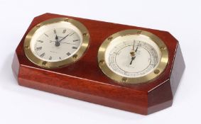 Wempe ships style wall clock and barometer, with circular brass bezels, housed in a shaped