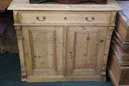 Pine cabinet with frieze drawer above two panelled cupboard doors, 95.5cm wide