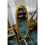 Pine framed 3/4 length oval robing mirror, on a turned frame with out-splayed legs