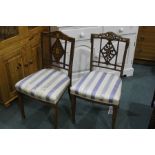 Pair of Edwardian bedroom chairs, with harebell swag inlaid cresting rails, foliate inlaid diamond