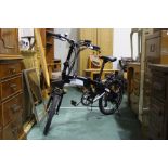 Raleigh Stow-E-Way electric folding bicycle, with charger and instruction manual