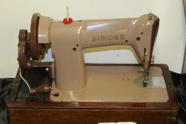 Singer manual sewing machine, housed in a domed case