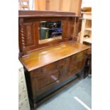 Edwardian oak sideboard, with bevelled mirror upstand flanked by two barley-twist pilasters, the