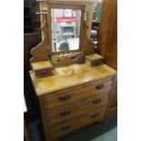 Edwardian beech dressing table, with bevelled mirror flanked by two small drawers, the base with