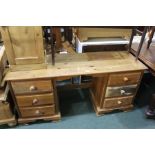 Pine kneehole desk/sideboard, with a rectangular top above five drawers, 145cm wide