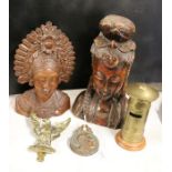Two hardwood carved busts, brass letter box form money box, brass door knocker in the form of an