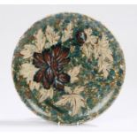 Late Victorian Art Pottery dish, decorated with flowers, label to reverse 26cm diameter