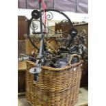 Wicker basket containing a quantity of metal chandeliers and light fittings (qty)