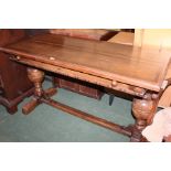 Oak refectory style table, with orb carved frieze, raised on bulbous turned supports and chamfered