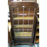 Oak book case, with single lead glazed door and adjustable shelves, 61cm wide