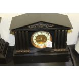 Black slate mantel clock, enamel dial with Arabic numerals, architectural design, 30cm x 28cm