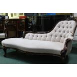 Victorian chaise longue, with button back upholstery, raised on scrolled legs