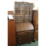 Oak bureau bookcase, with two lead glazed doors above the fall, three long drawers to the base, 76cm