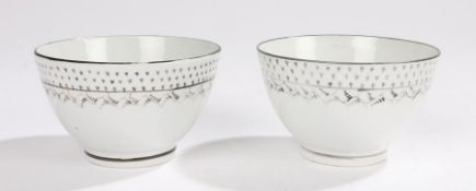 Pair of early 19th Century porcelain tea bowls, in white glaze with black edge decoration and a