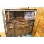 Oak court cupboard, with two angled lead glazed cupboards above two drawers and four cupboard doors,