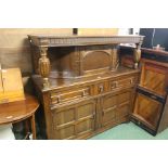 Oak court cupboard, with central cupboard above three frieze drawers and two panelled cupboard