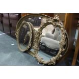 Oval gilt framed wall mirror, pierced gilt framed wall mirror, gilt wall mirror with tied bow