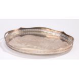 Plated oval tray with pierced wavy gallery and beaded rim, raised on four squat feet, 61cm x 41cm