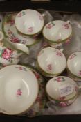 Royal Doulton part tea service decorated with floral sprays, consisting of nine teacups and saucers,