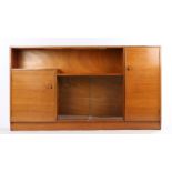 Castle Furniture teak sideboard, with open recess above to sliding glass doors, flanked by two