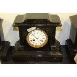 Edwardian black slate mantel clock, with an enamel dial and Roman numerals, architectural design,