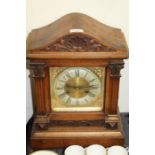 Mahogany cased mantel clock, the case with shell and scroll carved pediment and reeded pilasters,