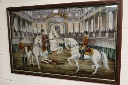 Framed woolwork picture, with figures on horseback, 82cm wide