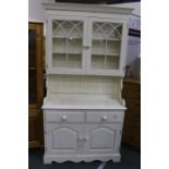 White painted pine dresser, the top with two arched glazed cupboards above a base with two frieze