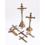 Collection of Corpus Christi, to include two brass examples and five wall hanging examples, (7)