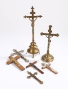 Collection of Corpus Christi, to include two brass examples and five wall hanging examples, (7)