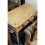 Painted pine side table, the rectangular top above two short drawer in turned legs, 90cm wide