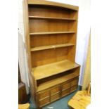 Nathan teak cabinet, with three shelves above an open recess and two panelled cupboard doors,