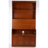 Nathan teak bookcase, with shelf above a fall front bureau, opening to reveal a pigeonholed interior