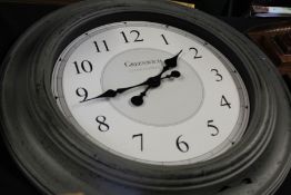 Greenwich Clock Company wall clock, the white dial with Arabic numerals, housed in a grey painted