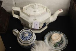 19th Century pottery teapot, with a swan to the handle above a fence and flower decorated body,