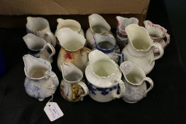 Collection of pottery and porcelain jugs, to include Wedgwood Fallow deer etc. (13)