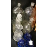 Two glass bottles, three glass decanters, three blue glass piano stands (8)