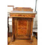 Edwardian walnut veneered davenport, with stationary compartment above the sloped writing surface,