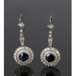 Pair of sapphire and diamond set earrings, the drops with diamond beams and circular sapphire and